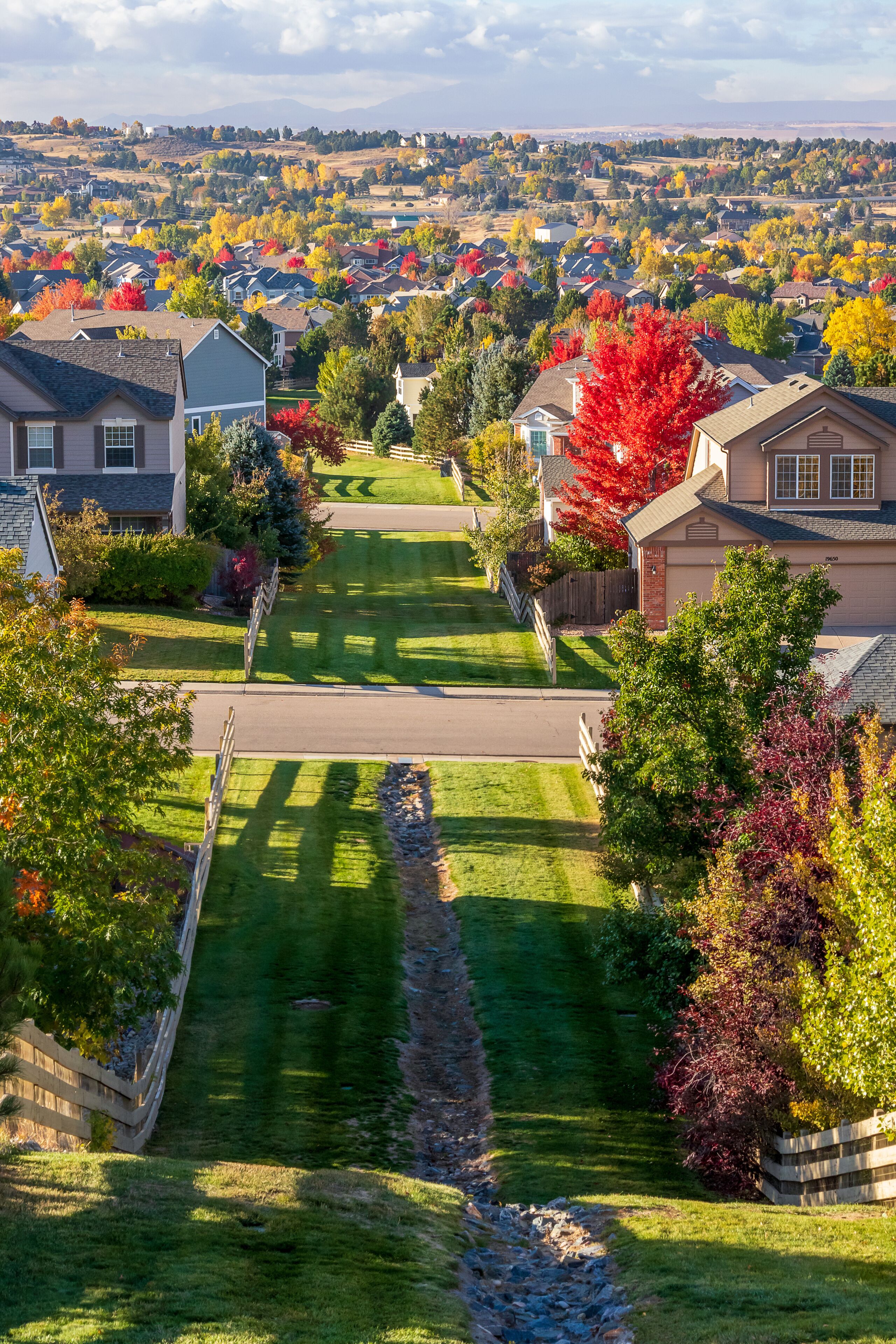 Colorado Living. Centennial, Colorado - Denver Metro Area Residential Autumn Panorama with the view of a Front Range mountains in the distance