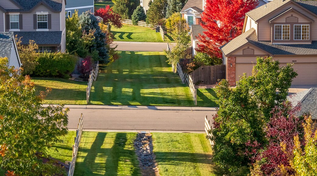 Colorado Living. Centennial, Colorado - Denver Metro Area Residential Autumn Panorama with the view of a Front Range mountains in the distance