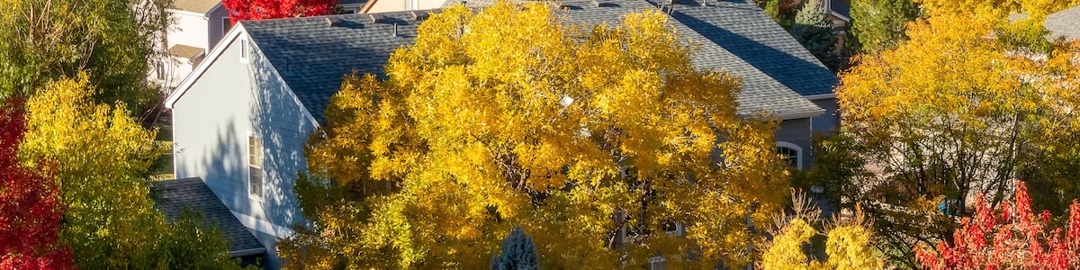 Colorado Living. Centennial, Colorado - Denver Metro Area Residential Autumn Panorama with the view of a Front Range mountains in the distance