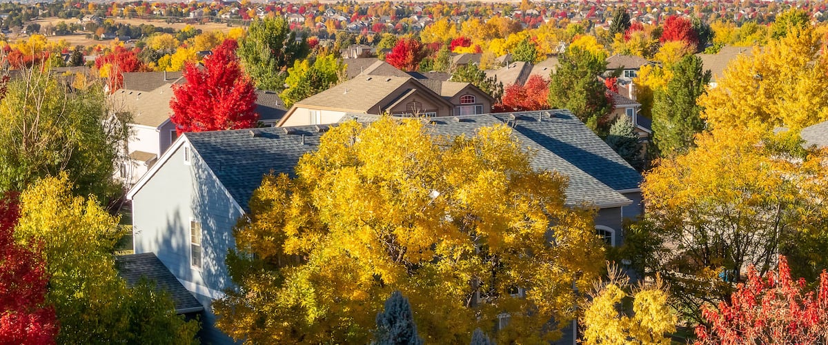 Colorado Living. Centennial, Colorado - Denver Metro Area Residential Autumn Panorama with the view of a Front Range mountains in the distance