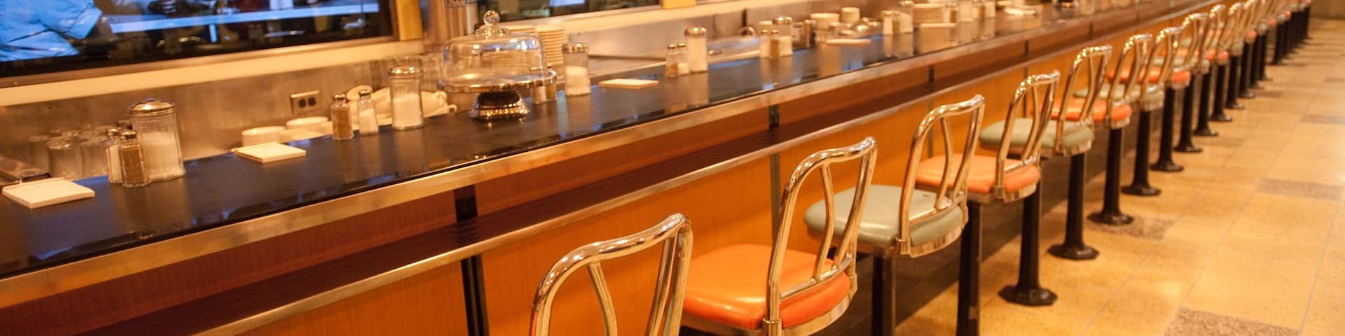 Greensboro which includes a bar and interior views