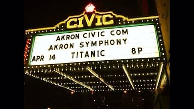 A theater marquee with the name 'CIVIC' and details about an event: 'AKRON CIVIC COM', 'AKRON SYMPHONY', 'APR 14', 'TITANIC', '8P'.