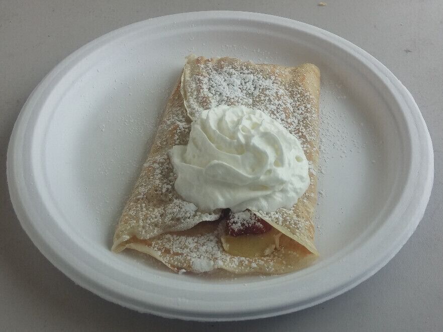 "The Crush" crepe from Crepe Boheme inside of the the PNC 2nd street market. Beneath the whipped cream and powdered sugar, stuffed inside the delicate crepe batter resides a curious concoction of fresh raspberries, quince paste and melted smoked brie. 
