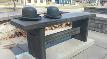 "Whose gift of powered flight lifted our world forever skyward."
A bronze bench tribute to the Wright Brothers.