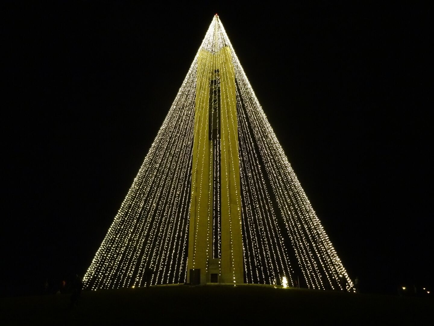 The Deeds Carillon illuminated for the holidays. An awesome spectacle and an awesomely short-lived road side attraction!

The Deeds Carillon, the largest carillon in Ohio had been transformed into the shape of a holiday tree towering 200 feet in the air and glowing with 20,000 white lights.

The plan was for the Carillon Tree of Light to be turned on nightly through New Year’s Day and be accompanied by the bells playing a medley of holiday classics on the hour.

I went on Sunday night and stood in wonderment of the melodic bells and the strands of light enhancing the already majestic silhouette of the carillon. 

Overnight, wind gusts in excess of 40 or even 50 miles per hour damaged many of the strands of light. By morning, the damage was such that the display was beyond repair and will now be taken down for the year.

Quite a whirlwind tale for the inaugural lighting of the the Deeds Carillon.  