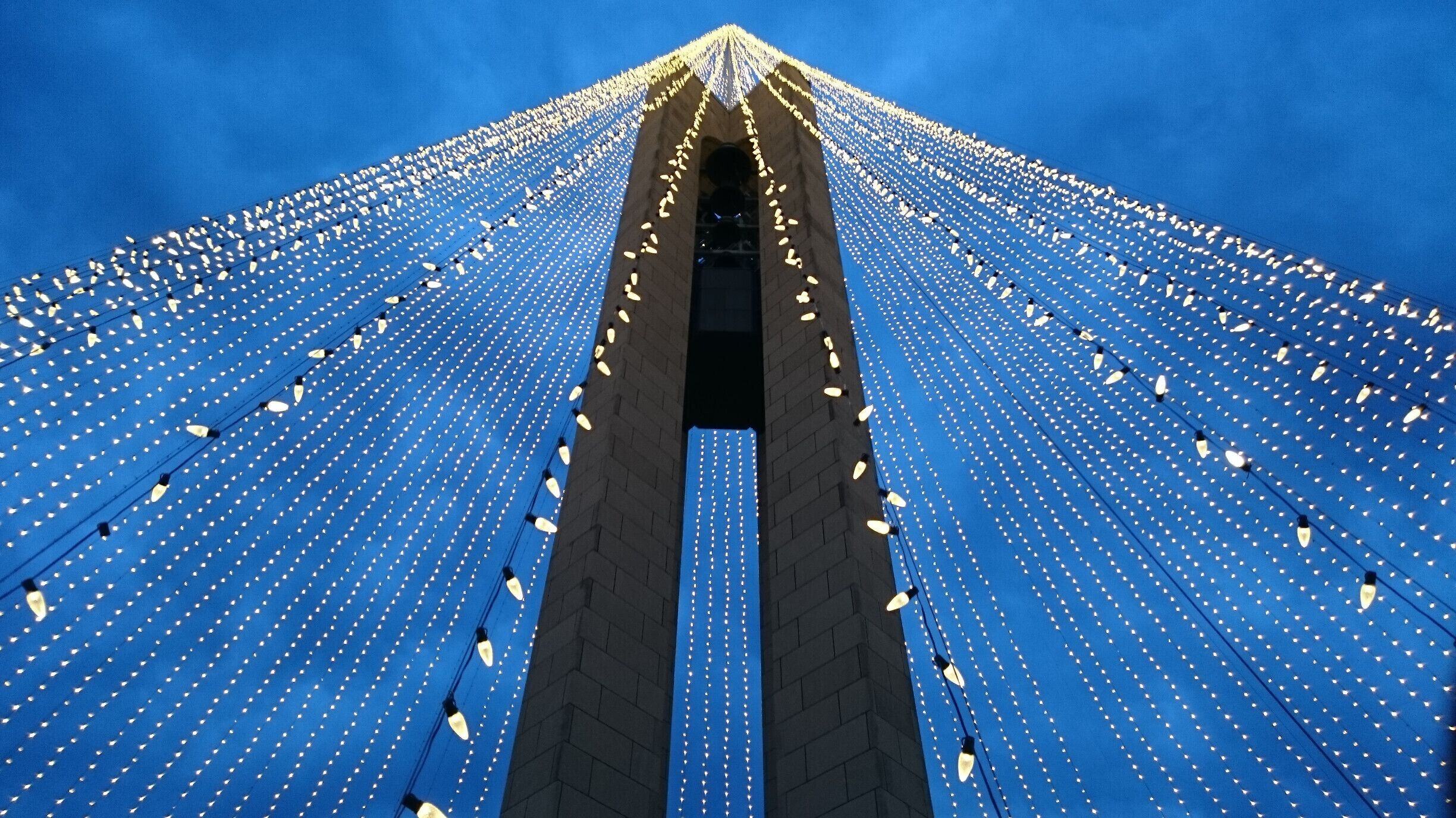 The Deeds Carillon illuminated for the holidays. An awesome spectacle and an awesomely short-lived road side attraction!

The Deeds Carillon, the largest carillon in Ohio had been transformed into the shape of a holiday tree towering 200 feet in the air and glowing with 20,000 white lights.

The plan was for the Carillon Tree of Light to be turned on nightly through New Year’s Day and be accompanied by the bells playing a medley of holiday classics on the hour.

I went on Sunday night and stood in wonderment of the melodic bells and the strands of light enhancing the already majestic silhouette of the carillon. 

Overnight, wind gusts in excess of 40 or even 50 miles per hour damaged many of the strands of light. By morning, the damage was such that the display was beyond repair and will now be taken down for the year.

Quite a whirlwind tale for the inaugural lighting of the the Deeds Carillon.  