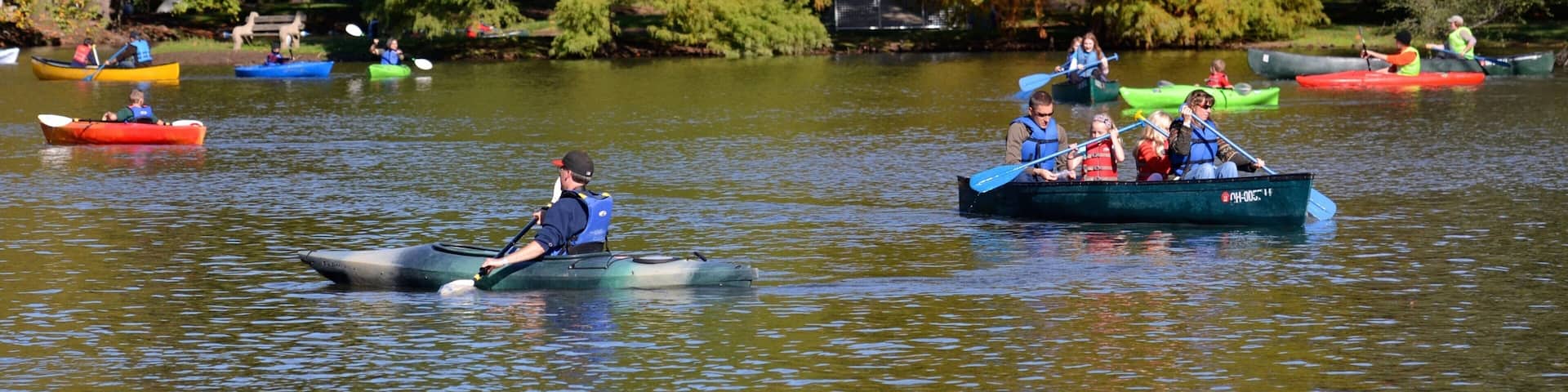 Dayton showing kayaking or canoeing and a lake or waterhole as well as a small group of people