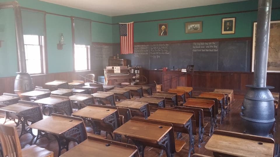 Locust Grove School No. 12 built in 1896 served as a one room school house near Springfield OH. The building has been moved and rebuilt inside Carillon Historical Park complete with the rope that rings the bell!