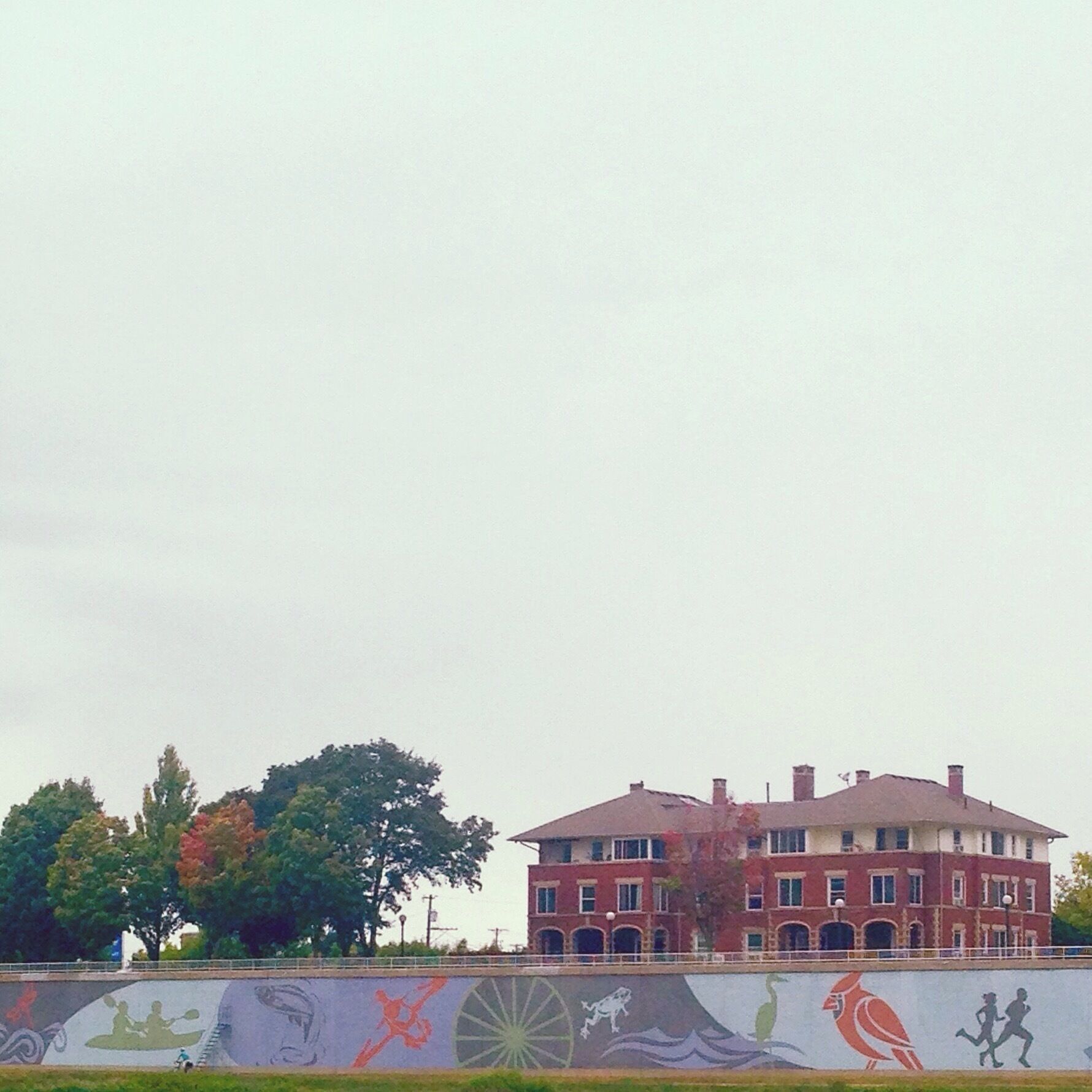 A shot of the newly finished mural across the river from Riverside Metro Park in Dayton, OH, along the Greater Miami River Bikeway. 