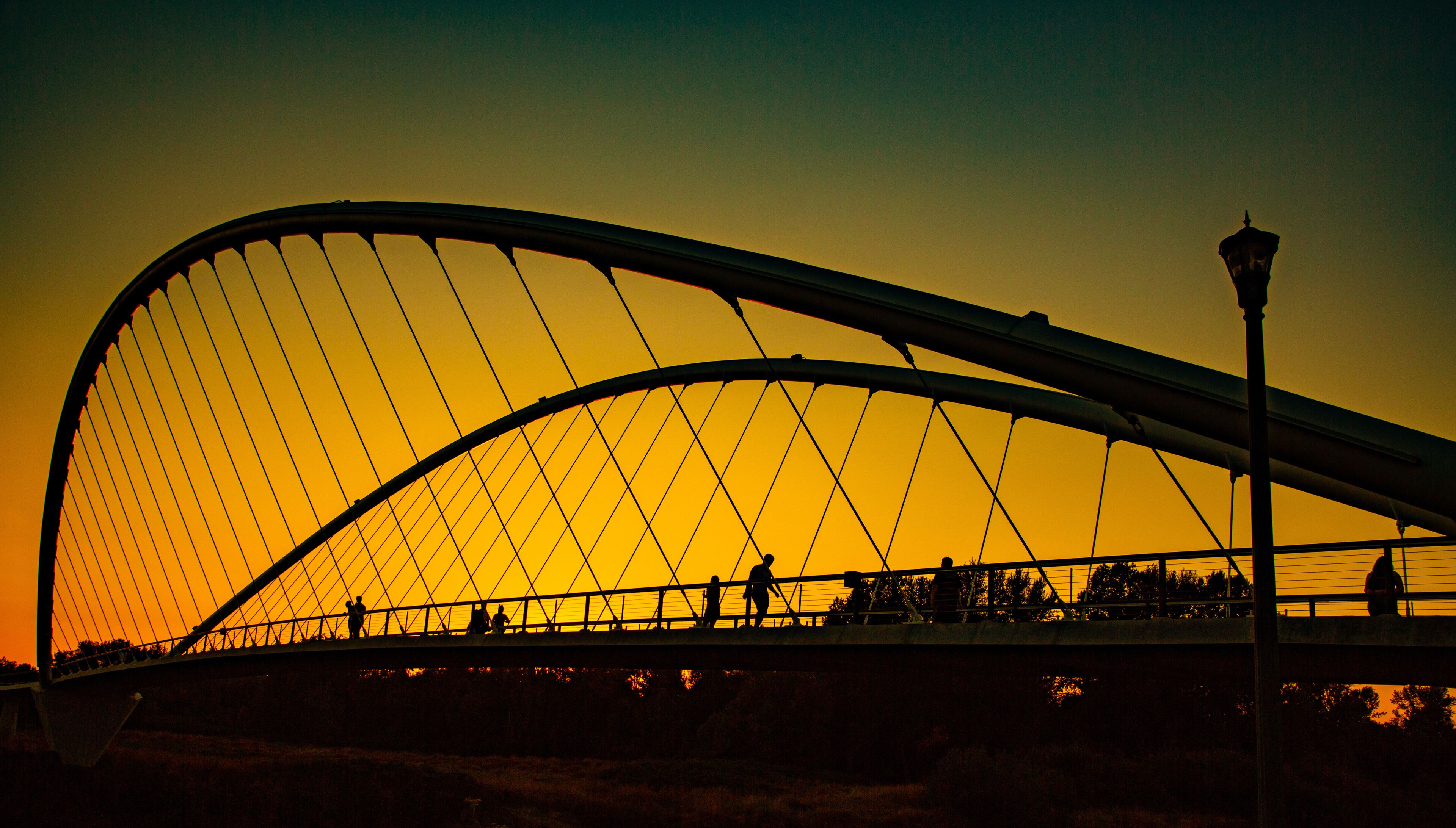 Double arch footbridge at sunset  from Salem Riverfront park to Minto Island, Oregon.