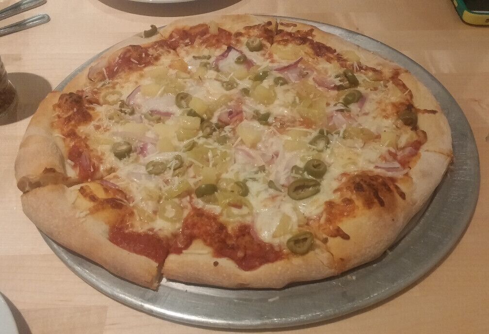 A banana pepper, green olive, onion and pineapple pie from The Tomato Head in the historic Market Square district of Knoxville TN.