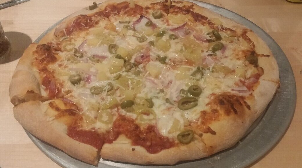 A banana pepper, green olive, onion and pineapple pie from The Tomato Head in the historic Market Square district of Knoxville TN.