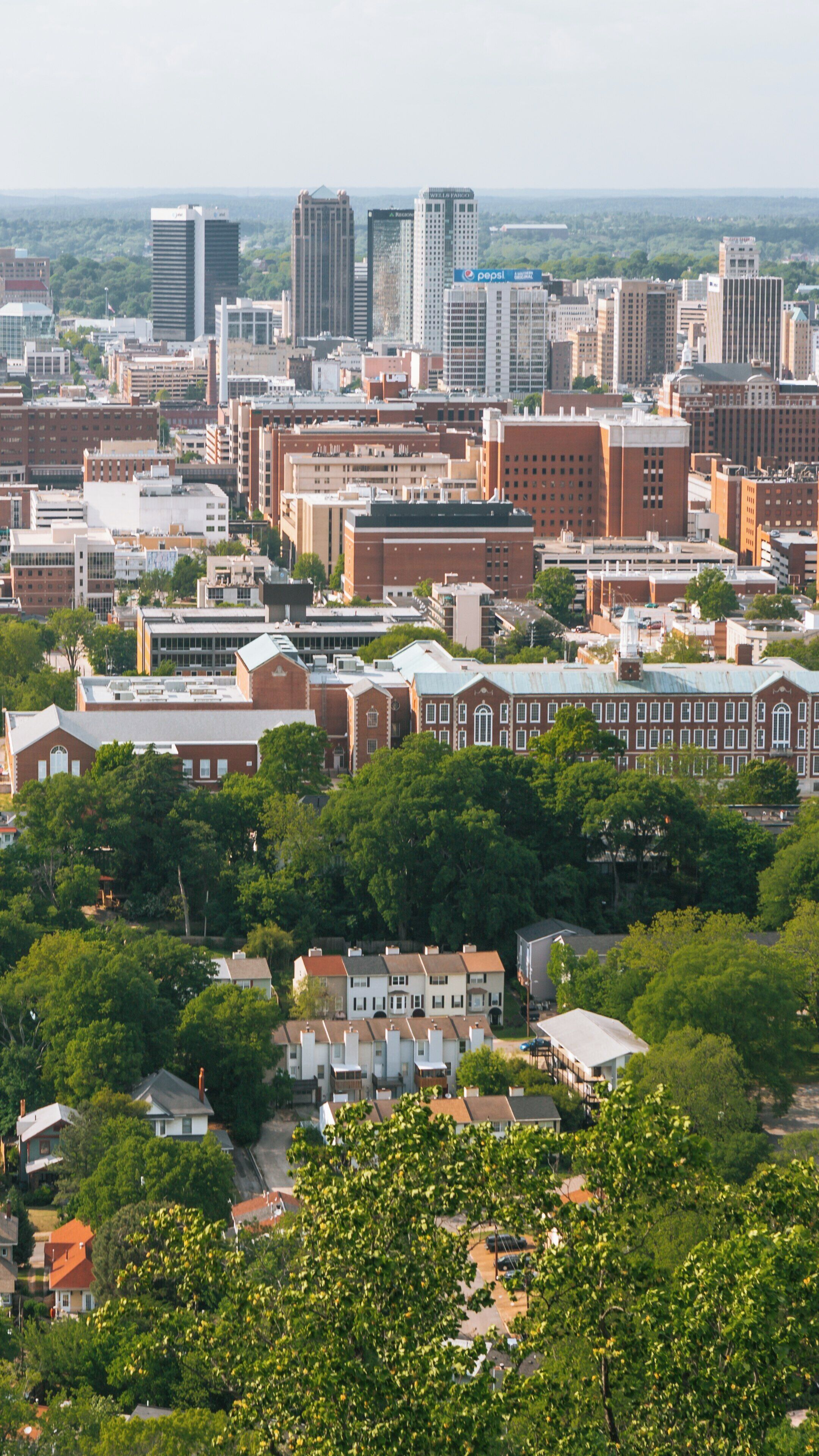 Vulcan Statue overlooks Birmingham skyline showcasing urban beauty and rich heritage in Alabama