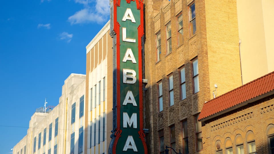 A building with a marquee sign reading "ALABAMA" against a clear blue sky.