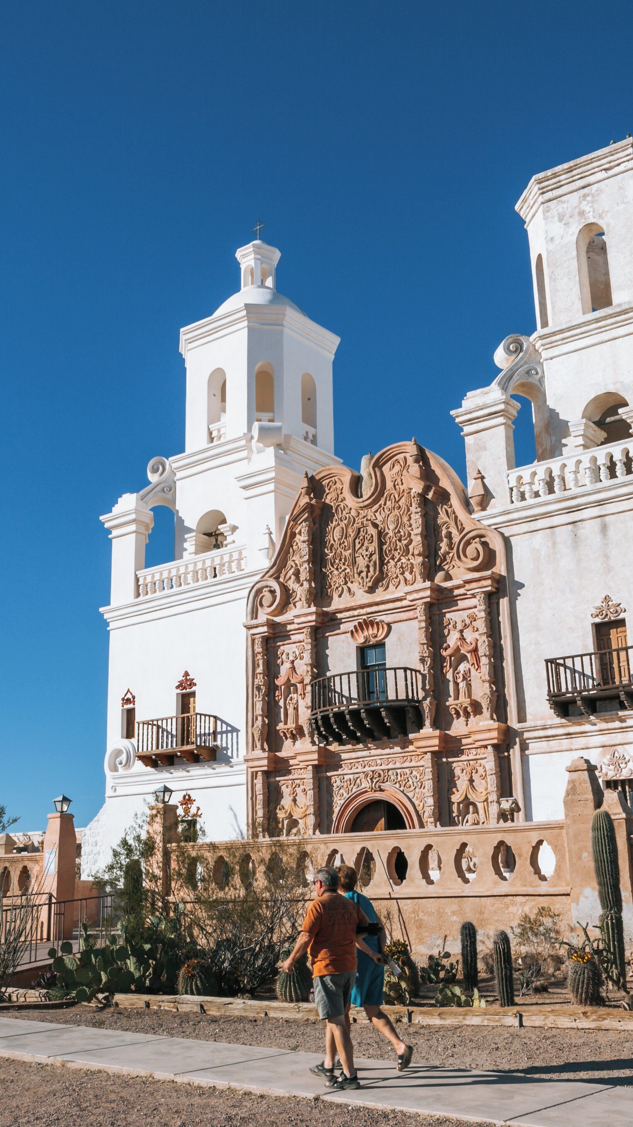 Exploring the historic Mission San Xavier del Bac in Tucson, Arizona on a clear blue day