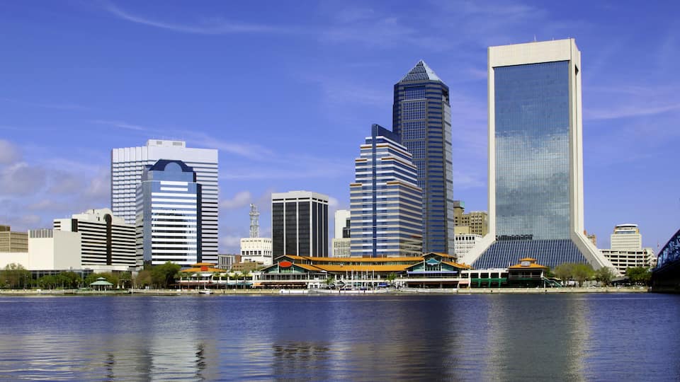 A city skyline with modern skyscrapers and a waterfront.