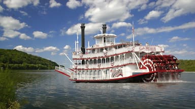 A steamboat named Spirit of Peoria traveling on a river.
