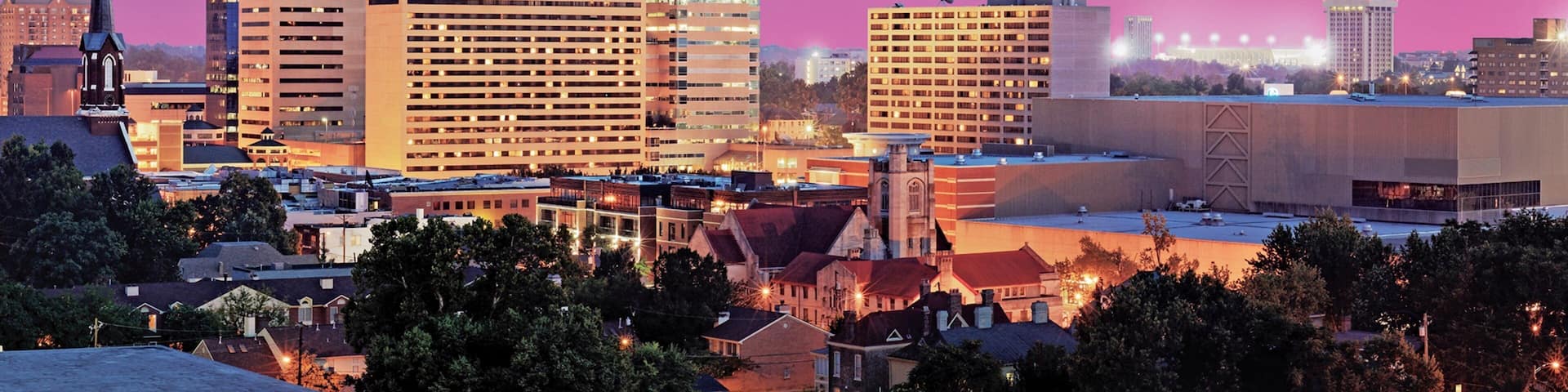 Lexington featuring a sunset and a city