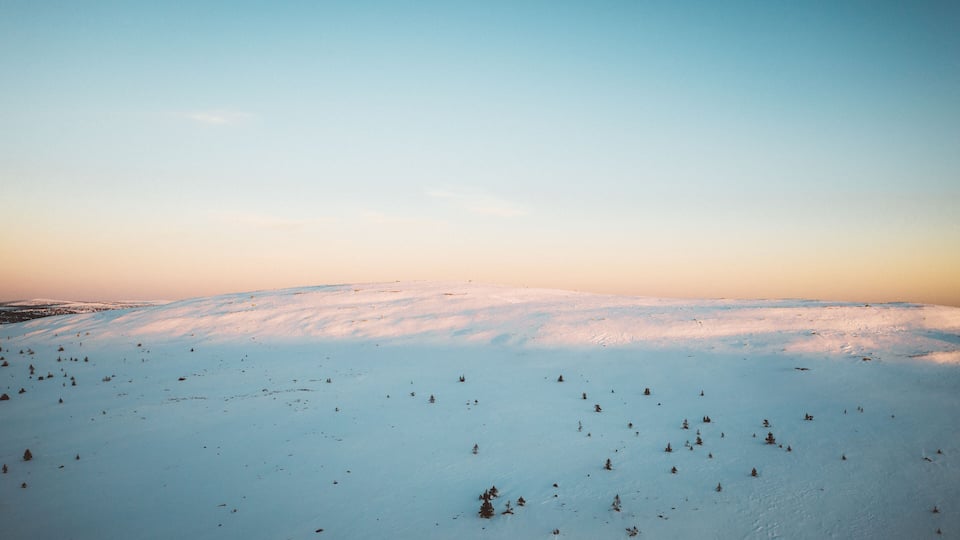 A snowy landscape with a clear sky.