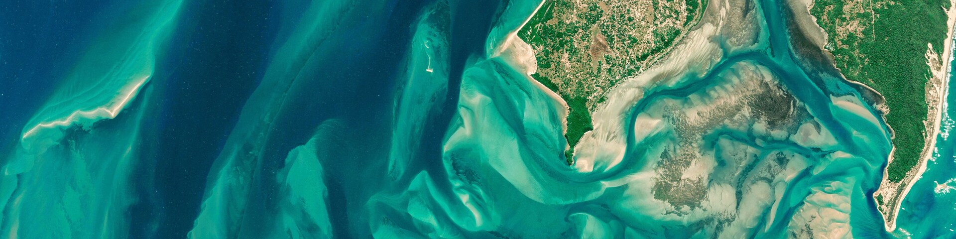 Satellite view of the coast of Mozambique aerial view of Inhaca Island, Mozambique, ocean and pristine islands. Africa. Element of this image is furnished by Nasa