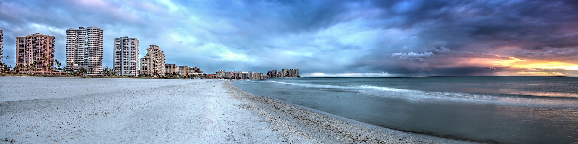 Sunset and clouds over the calm water of Tigertail Beach on Marco Island