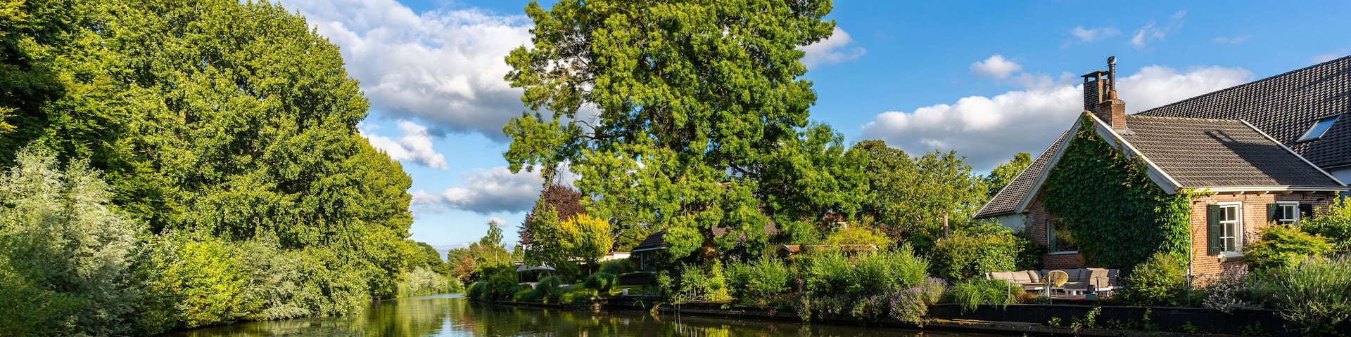 Scenic view of river Kromme Rijn in Bunnik on a sunny summer day