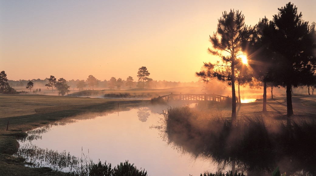 Gulf Shores which includes mist or fog, a sunset and a river or creek
