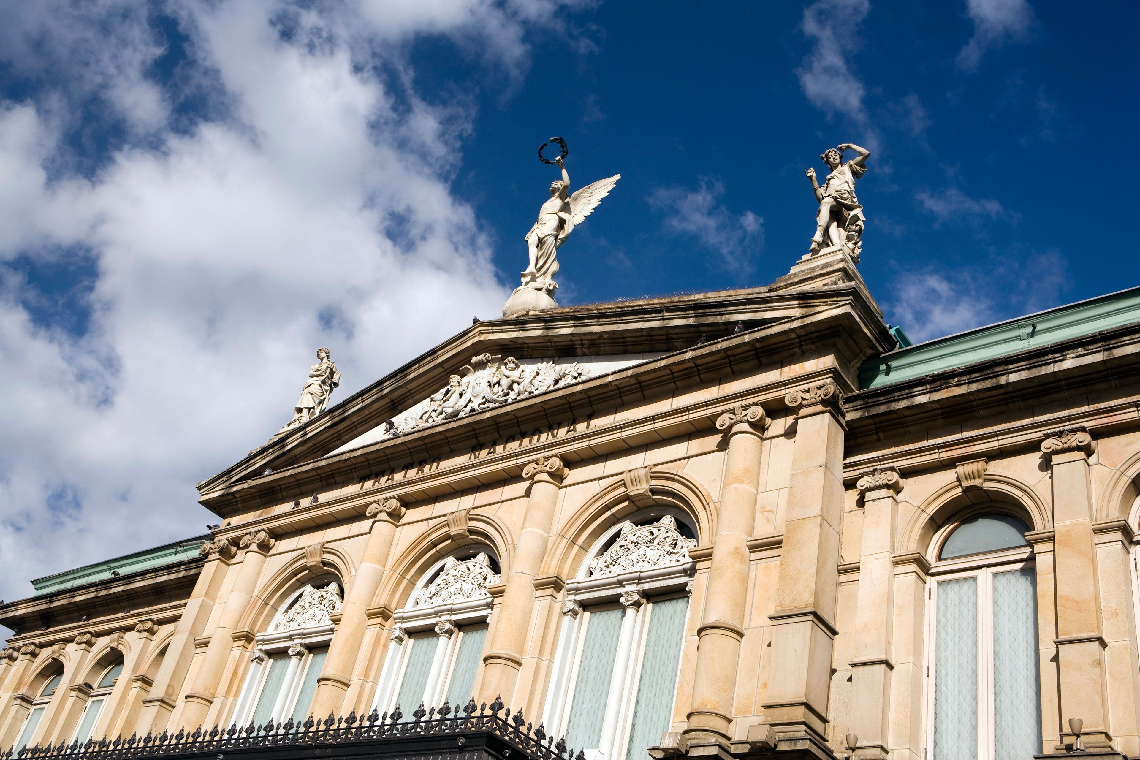AT3YDJ Costa Rica San Jose Plaza de la Cultura Teatro Nacional National Theatre exterior statuary above portico