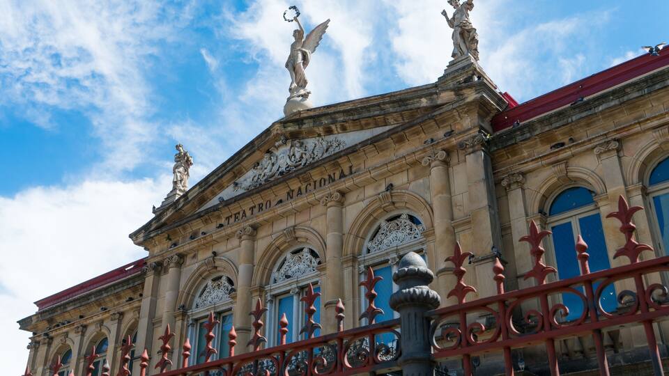 View of the gable roof of National Theater in Costa Rica downtown square with angle, beautiful blue sky and copy space for text.