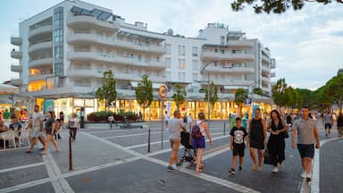 Jesolo showing street scenes as well as a small group of people