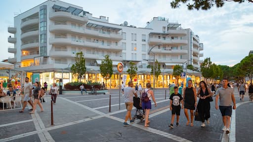Jesolo showing street scenes as well as a small group of people