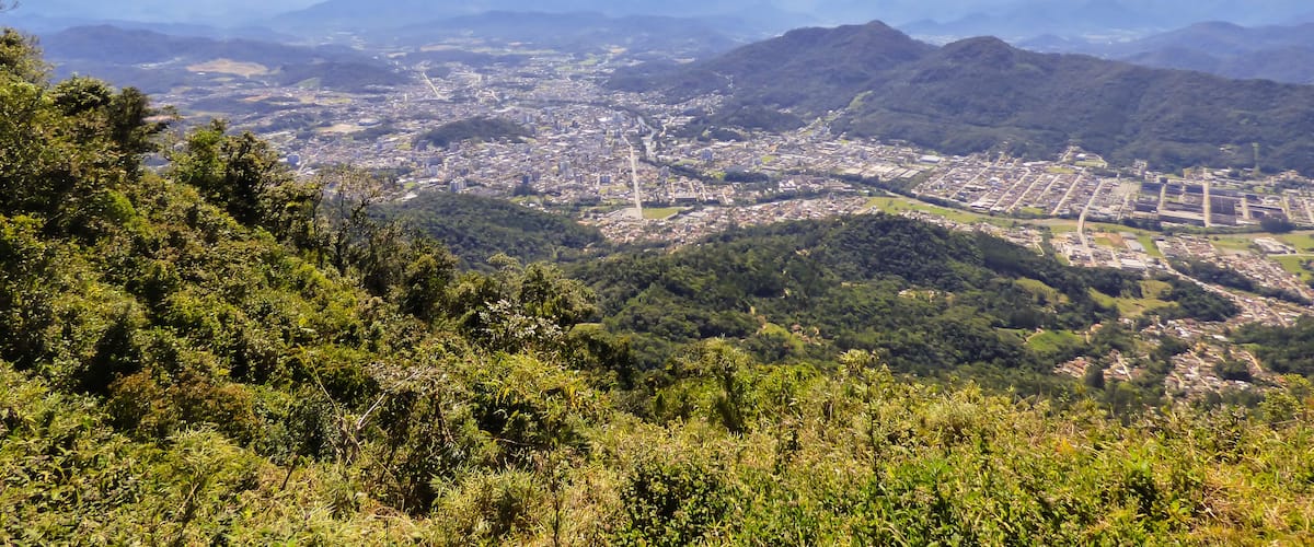 Mountains, the city and the Atlantic Forest: view from the "Morro das Antenas" in Jaragua do Sul, Brazil