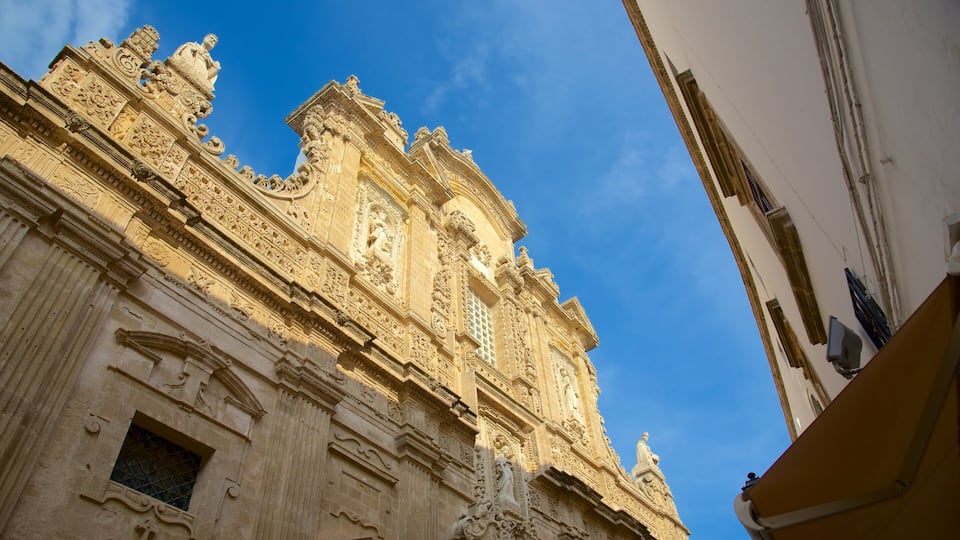 A detailed facade of a historic building with ornate carvings and statues.