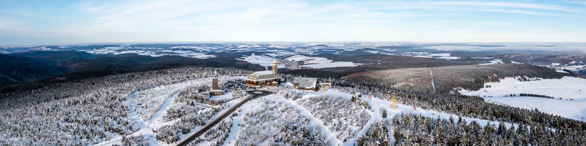 Fichtelberg highest mountain in Erzgebirge in winter panorama aerial view photo in Oberwiesenthal, Germany