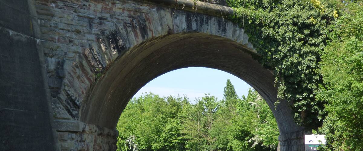 A short walk along a stretch of the Trent & Mersey Canal in Rugeley, Staffordshire. I got on at The Mossley (near Armitage Road) and got of halfway up Love Lane heading towards Leathermill Lane. James Brindley was the engineer of the Trent and Mersey Canal. It was planned in 1765 and fully opened by 1777. bridge - Rail Bridge Rail Bridge just north of Bridge 66, Trent & Mersey Canal Grade II listed Viaduct over Trent and Mersey Canal at Sk 0485 1780 Listing Text The following buildings shall be added to the list:- SK 01 NW RUGELEY TRENT AND MERSEY CANAL 3/10002 Viaduct over Trent and Mersey Canal at SK 0485 1780 - II Viaduct over Trent and Mersey Canal. Mid C19. Coursed, rough-textured stone with brick arch soffit. Single span with towpath. Semicircular headed arch dramatically skewed. Rusticated stone voussoirs. Roll-moulded stone cornice above crown. 3 C20 concrete buttresses to north towpath side. Listing NGR: SK0489817862 This text is from the original listing, and may not necessarily reflect the current setting of the building.