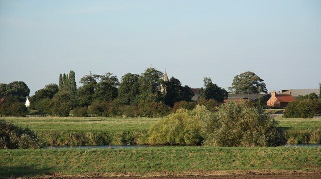 View to Holme. View from St.Wilfrid's church at North Muskham across the River Trent to Holme, with the spire of St.Giles' church 590811 just visible in the trees. According to the 18th century Nottinghamshire antiquary Thoroton, Holme and North Muskham were on the same bank of the Trent until the River changed course during a catastrophic flood in the 16th century.