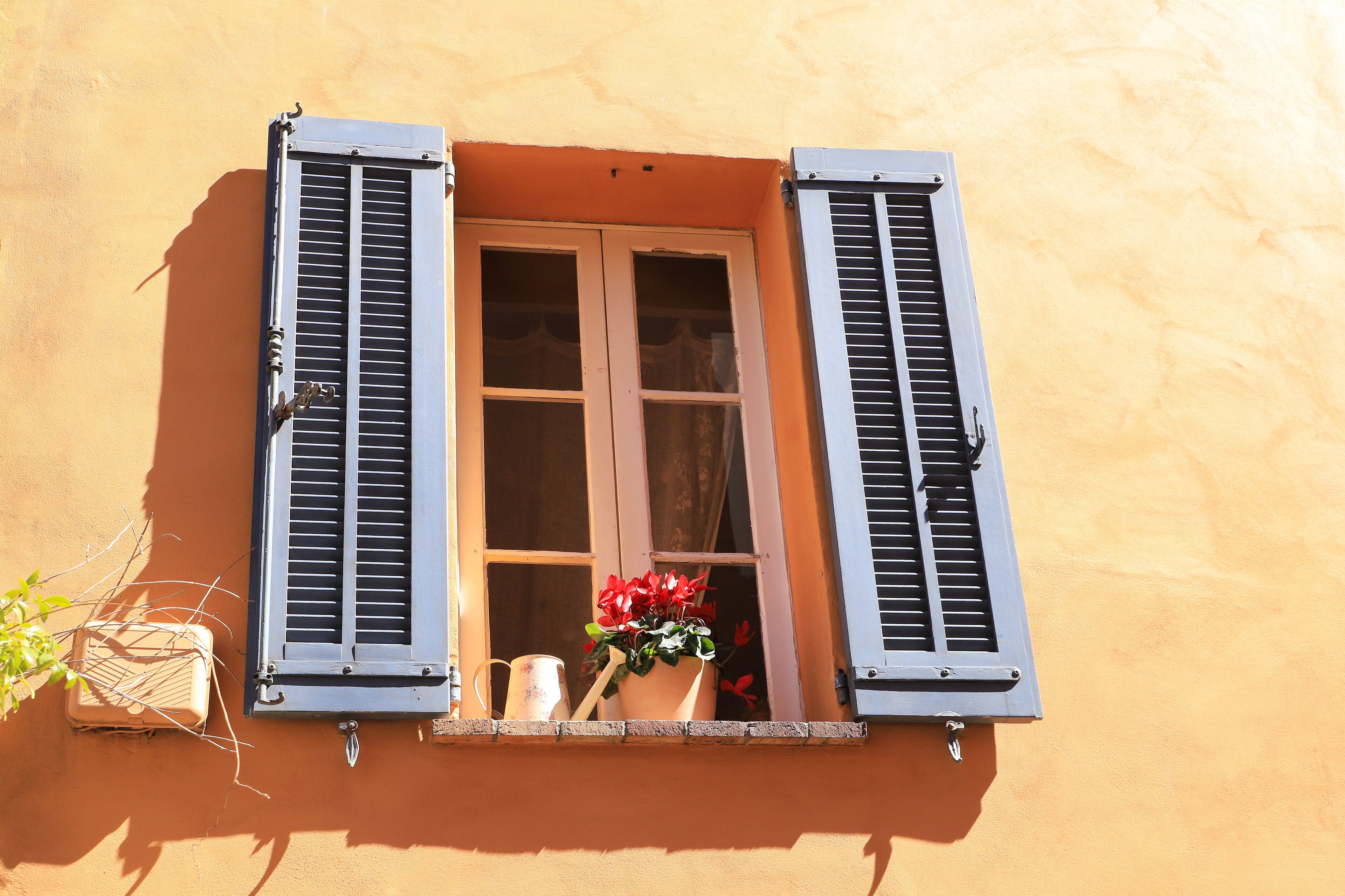 A close up window in the medieval village Mouans-Sartoux near french riviera - France