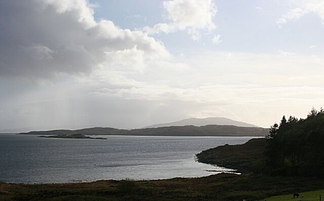 Asknish Bay. The view of Asknish Bay from Loch Melfort Hotel. The nearest islet is Eilean Creagach, and the low-lying land beyond is the island of Shuna. Beyond Shuna is the grey outline of Scarba, and Jura is faintly visible in the distance at left. Amazingly, 1272932 was taken only a few minutes later, such was the changeability of the weather.