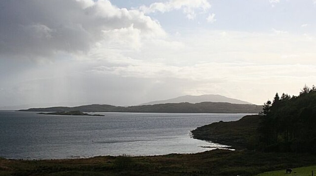 Asknish Bay. The view of Asknish Bay from Loch Melfort Hotel. The nearest islet is Eilean Creagach, and the low-lying land beyond is the island of Shuna. Beyond Shuna is the grey outline of Scarba, and Jura is faintly visible in the distance at left. Amazingly, 1272932 was taken only a few minutes later, such was the changeability of the weather.
