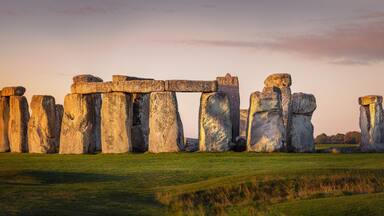 Beautiful panorama of Stonehenge during early morning. Sunrise glow seen on the historical landmark