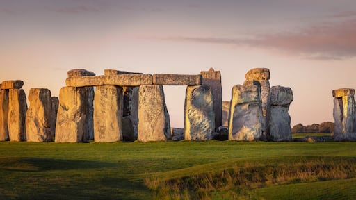 Beautiful panorama of Stonehenge during early morning. Sunrise glow seen on the historical landmark