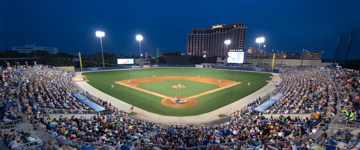 A baseball stadium filled with spectators during a game.
