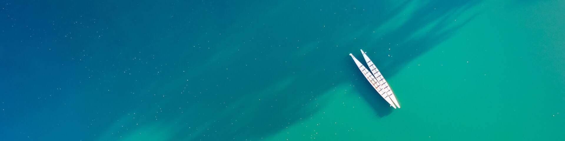 Minimalist scene with a couple of kayaks seen from above on Parsippany lake, NJ.