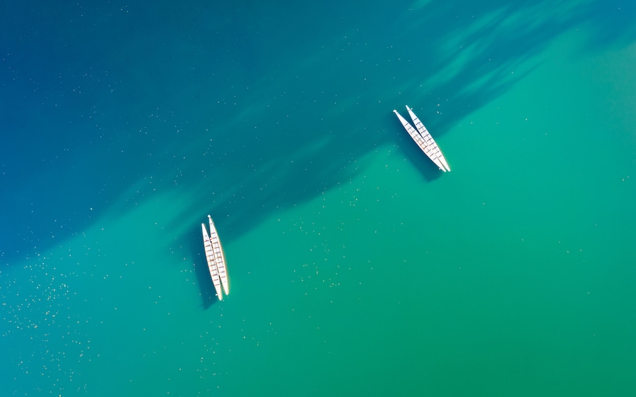 Minimalist scene with a couple of kayaks seen from above on Parsippany lake, NJ.