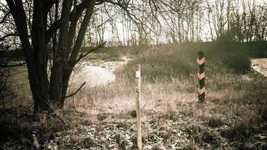 Part #10: Border Stones
The direct course of the border was demarcated by border stones. The border stone preserved here was right on the edge of a field while the border posts, visible from afar, were 1 - 2 m away from the border line, on east german territory. The border installation were always ata certain distance from the actual border line, at this point, this is over 50 m.