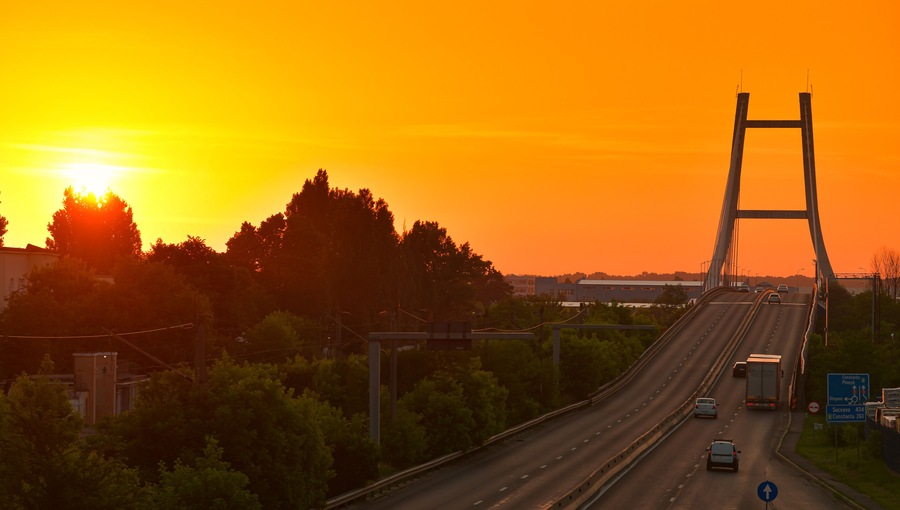 Sunrise over Otopeni Bridge, next to the ring road of Bucharest (Centura Bucuresti). Transportation industry, roads of Romania, 2022.