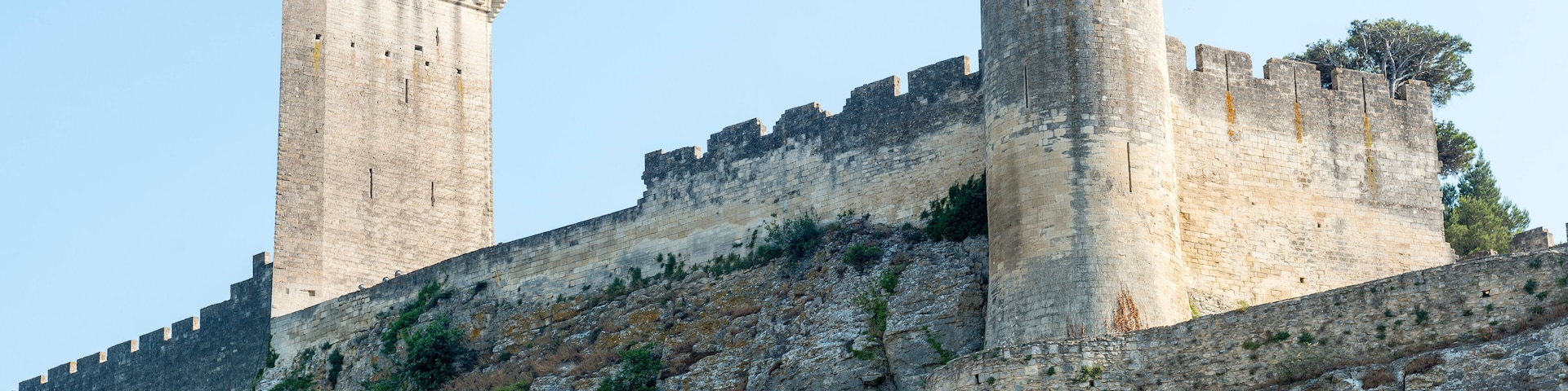 A medieval castle with two prominent towers and a fortified wall.