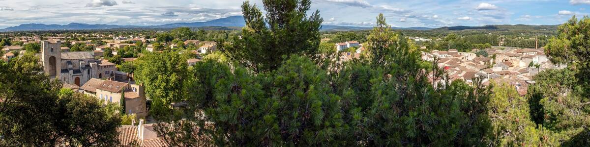 Pernes les Fontaines, small typical town of Provence and mountain range on the background, Vaucluse, France, Europe