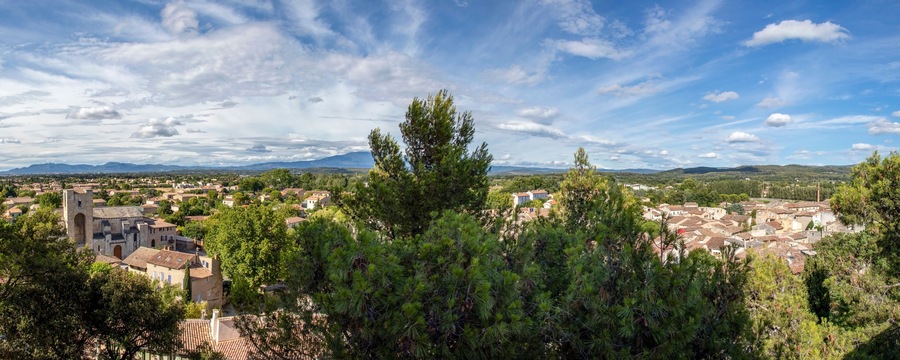 Pernes les Fontaines, small typical town of Provence and mountain range on the background, Vaucluse, France, Europe