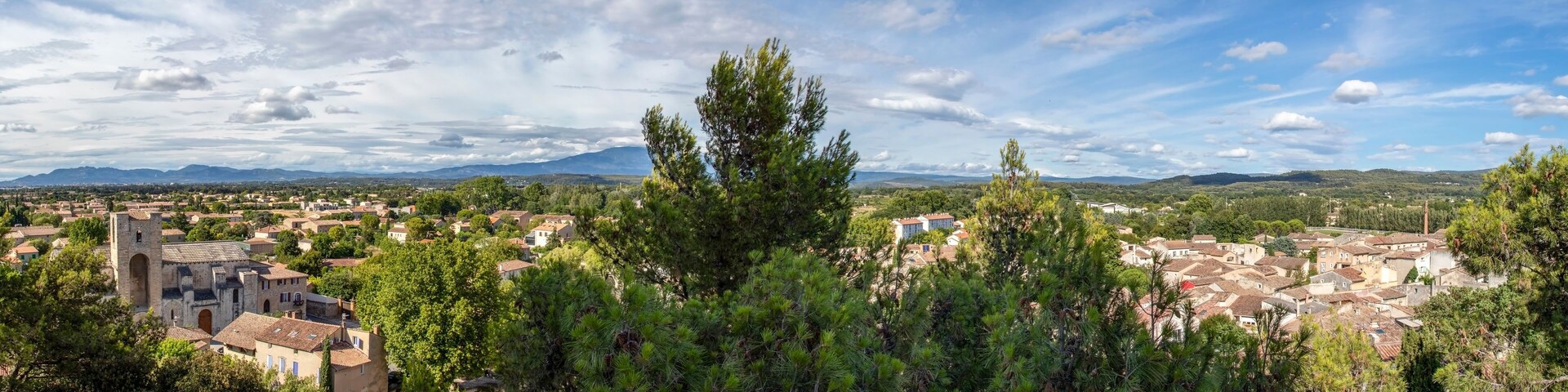 Pernes les Fontaines, small typical town of Provence and mountain range on the background, Vaucluse, France, Europe